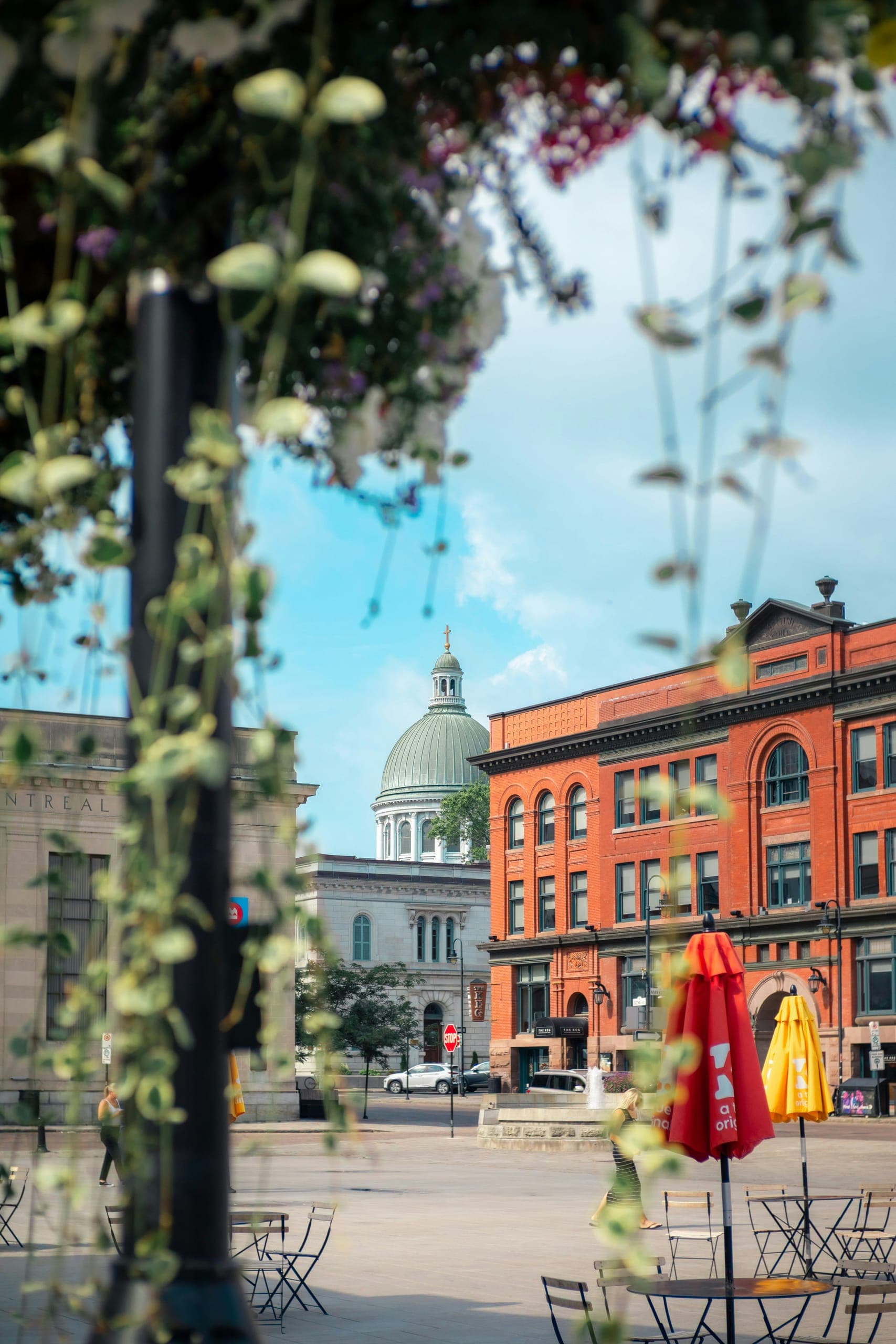 Springer Market Square with cafe umbrellas and the cathedral dome behind